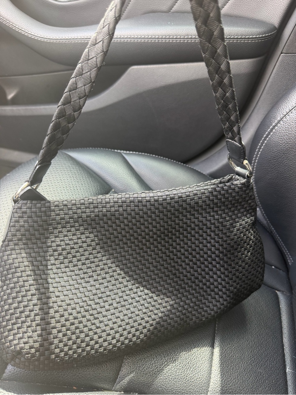 The Sak Black Woven Shoulder Bag with Braided Strap and leather detailing